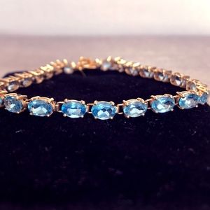 14k Gold bracelet with Topaz stones.